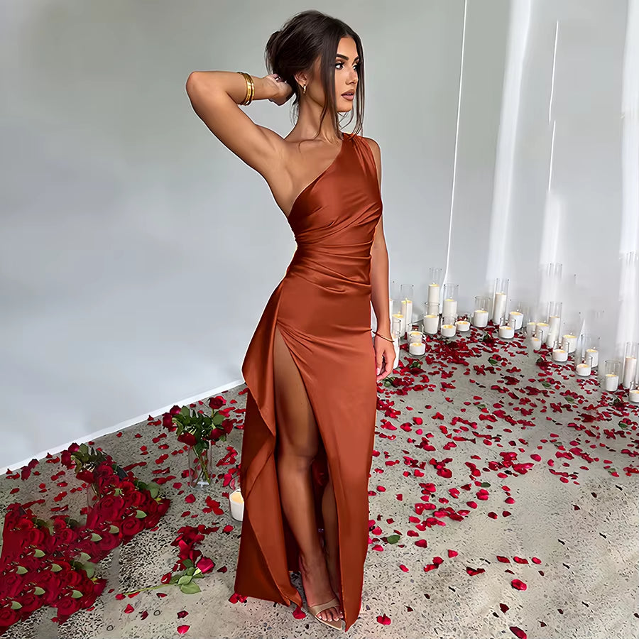 Exude timeless sophistication in this one-shoulder satin gown, designed for summer soirées and evening elegance. Featuring a sleeveless silhouette, daring high slit, and alluring backless detail, this dress is the epitome of graceful allure—perfect for cocktail parties, formal gatherings, or any occasion where elegance is essential