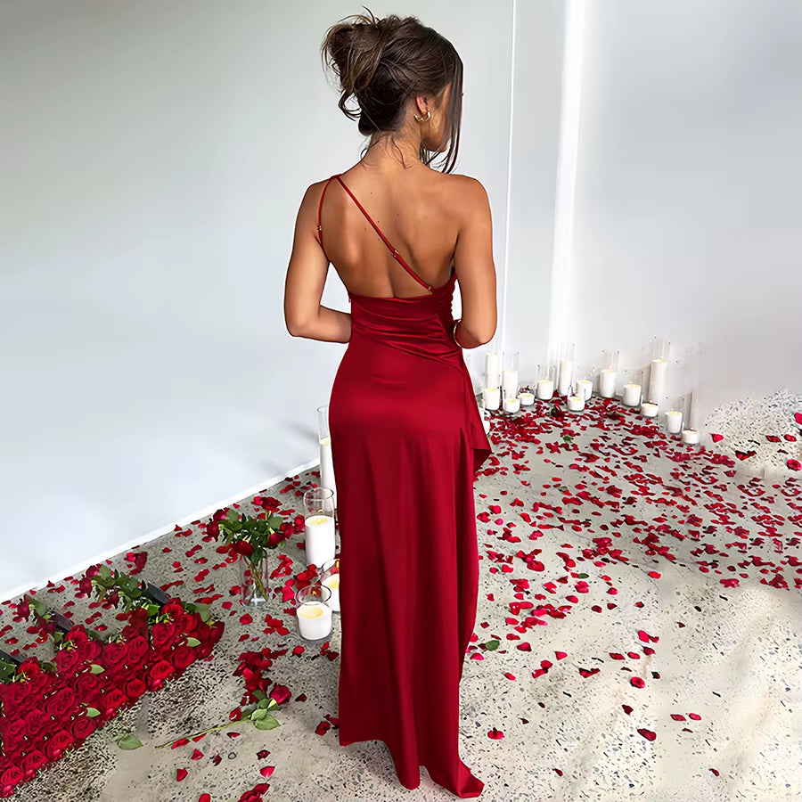 Exude timeless sophistication in this one-shoulder satin gown, designed for summer soirées and evening elegance. Featuring a sleeveless silhouette, daring high slit, and alluring backless detail, this dress is the epitome of graceful allure—perfect for cocktail parties, formal gatherings, or any occasion where elegance is essential